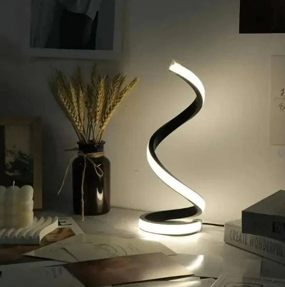 Modern LED Spiral Table Lamp with three-speed dimming and USB-powered switch on a bedroom table