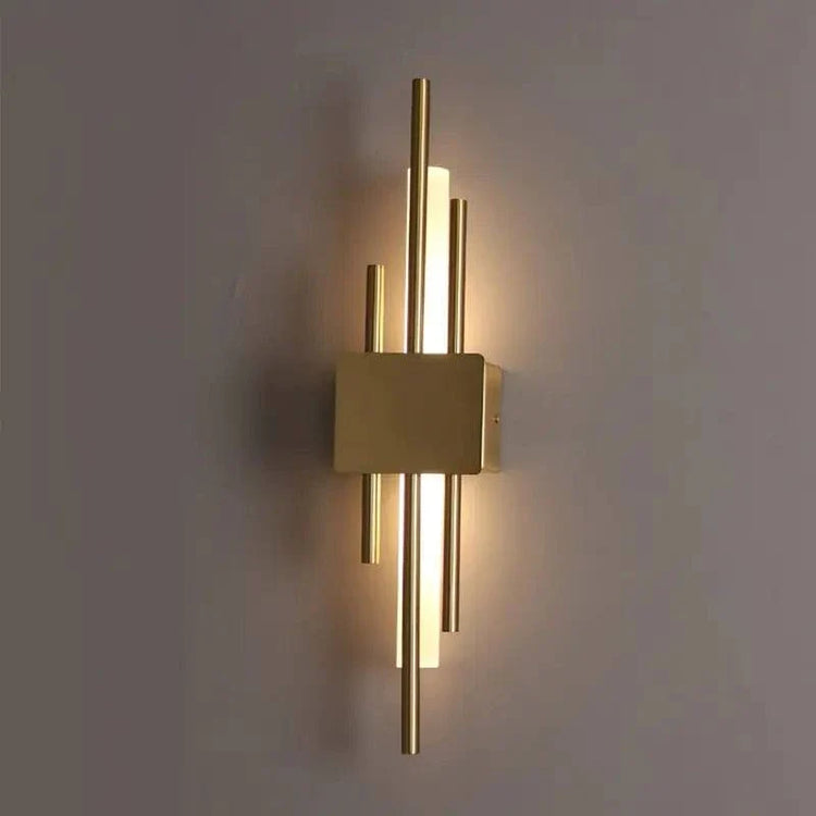 Modern LED Wall Lamp in gold metal with vertical rods and frosted acrylic diffusers emitting warm light