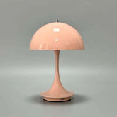 Portable rechargeable LED lamp with dimming and USB charging on table