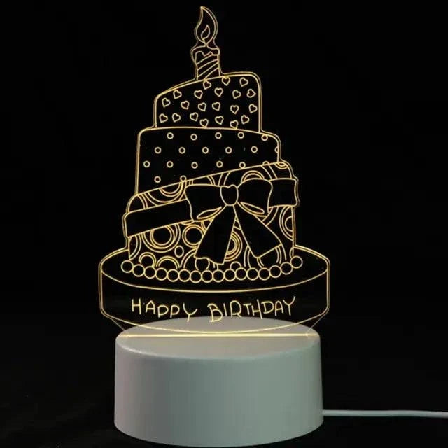 3D LED Lamp shaped like a birthday cake with a candle, hearts, bow, and Happy Birthday text in yellow light