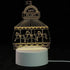 3D LED Lamp with yellow glowing carousel horses and Happy Holidays sign, clear acrylic design on white base