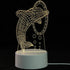 3D LED Lamp featuring a dolphin jumping through a hoop design with a white base and warm yellow light