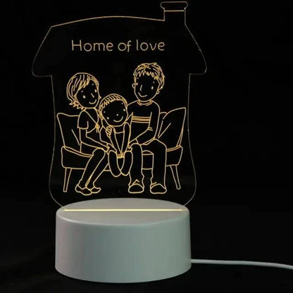 3D LED Lamp with a white base featuring a warm yellow glowing optical illusion of a family sitting on a sofa inside a house outline with &