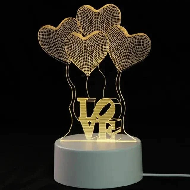 3D LED Lamp with a white base featuring a yellow illuminated optical illusion design of three heart-shaped balloons and the word LOVE
