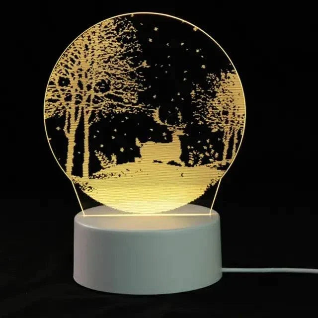3D LED Lamp featuring a white base with a glowing circular panel displaying a tree and deer optical illusion in warm yellow light