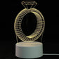 3D LED Lamp shaped like a wireframe diamond ring emitting soft yellow light on a white circular base