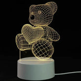 3D LED Lamp featuring a yellow wireframe teddy bear holding a heart, with a white round base and illuminated lines