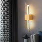 Modern LED wall lamp with sleek design and warm white light illuminating a contemporary room