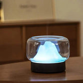 Ultrasonic air humidifier with LED lamp creating soothing ambient light in modern room