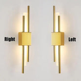 Modern LED wall lamp with sleek iron and acrylic design in gold, emitting warm white light.