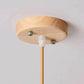 Kuma Bamboo Lamp emitting warm light with eco-friendly bamboo design in cozy room setting
