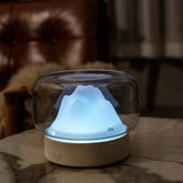 Ultrasonic air humidifier with LED lamp providing quiet air moisture and ambient lighting in modern room