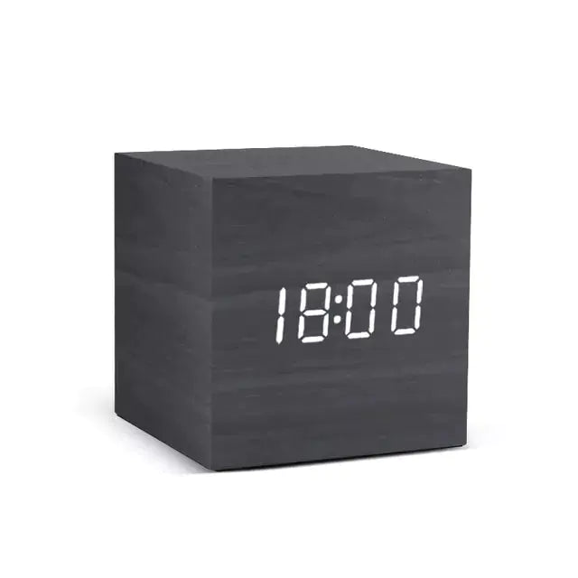 Alarm LED Watch, black wooden cube clock with a bright white digital LED display showing 18:00