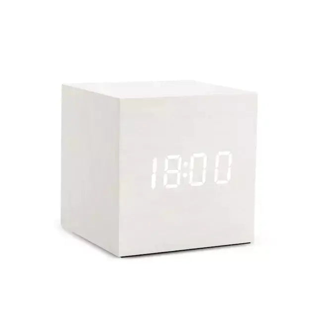 Alarm LED Watch, a white cube-shaped digital clock with a bright LED time display and smooth wooden finish