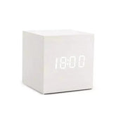 Alarm LED Watch, a white cube-shaped digital clock with a bright LED time display and smooth wooden finish