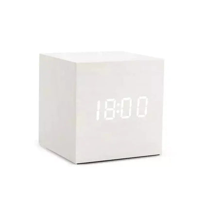 Alarm LED Watch, a white cube-shaped digital clock with a bright LED time display and smooth wooden finish