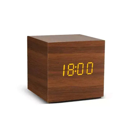 Alarm LED Watch, square dark wood desktop clock with a bright yellow digital display showing 18:00