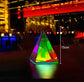 Aura Pyramid Lamp with multicolored LED illumination in a transparent acrylic pyramid shape approximately 15cm tall