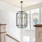 Black & Gold Lantern tiered chandelier with 8 lights, showcasing industrial farmhouse style in black metal with gold accents