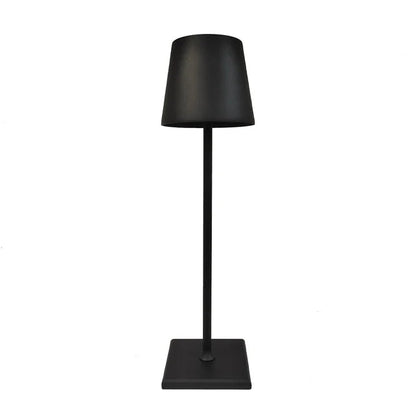 Cordless lamp in matte black metal with a minimalist design, featuring a square base and tapered shade for versatile lighting.
