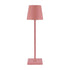 Cordless lamp in muted pink color with a minimalist design, featuring a conical shade and square base.