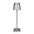 Cordless lamp with a sleek silver metal base and shade, featuring minimalist design and smooth finish for versatile lighting.