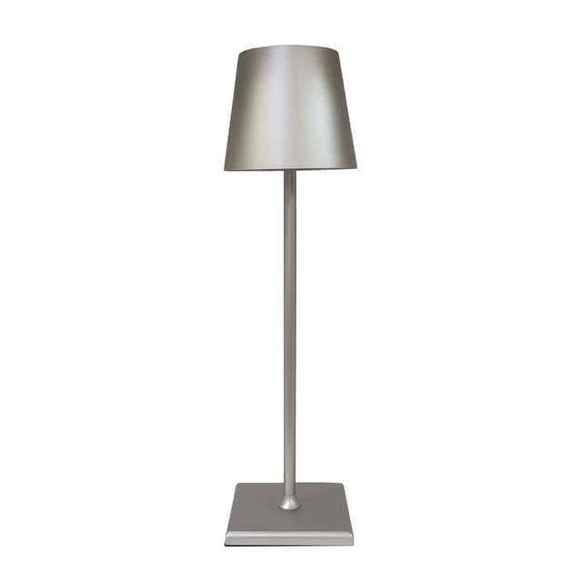 Cordless lamp with a sleek silver metal base and shade, featuring minimalist design and smooth finish for versatile lighting.
