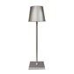 Cordless lamp with a sleek silver metal base and shade, featuring minimalist design and smooth finish for versatile lighting.