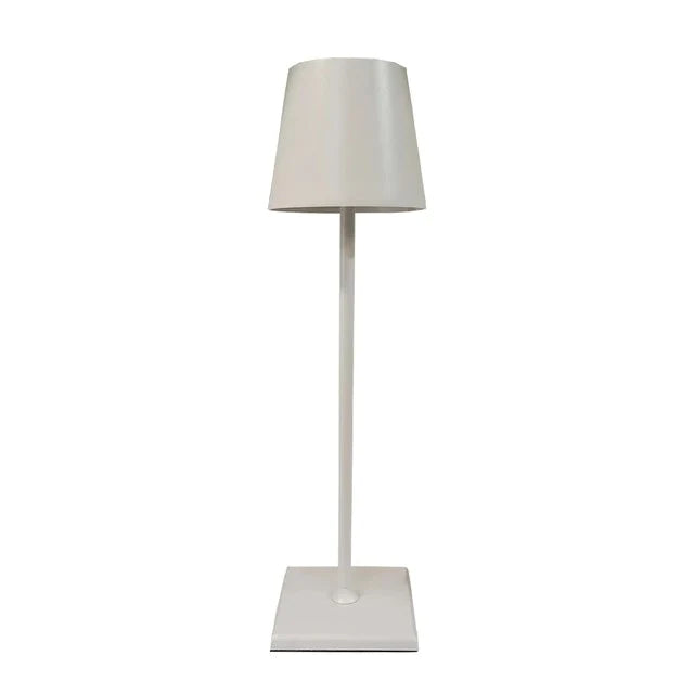 Cordless lamp with a sleek white metal design, featuring a cylindrical shade and square base for modern minimalist style.