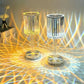 Cristal Lamp pair featuring clear faceted glass shades with intricate ribbed patterns, emitting warm and cool ambient light effects