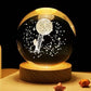 Crystal Night Ball, dark glass sphere with moon, stars and ladder design on a wooden base for ambient lighting
