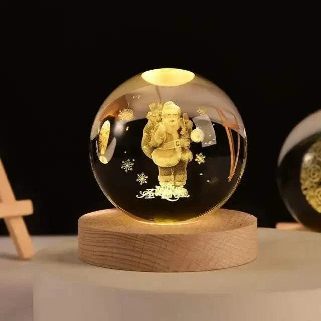 Crystal Night Ball, clear glass sphere with etched teddy bear and snowflakes on a natural wood base