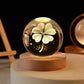 Crystal Night Ball, clear glass sphere with etched flower, stars and crescent moon on a round wooden base