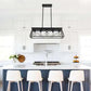 Farmhouse Chandelier with black iron rectangular frame and five vintage-style exposed bulbs hanging above a white kitchen island with four white chairs