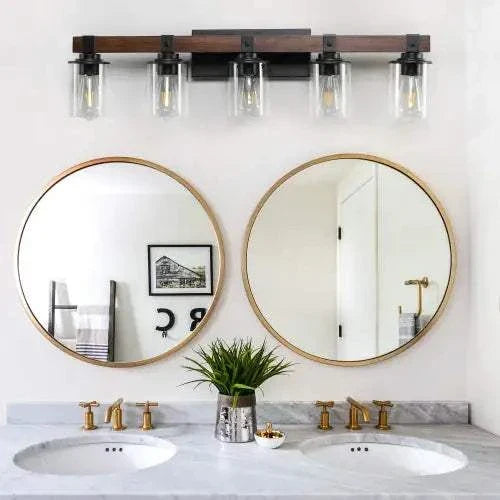 Farmhouse Dresser Lamps featuring a rustic black iron frame with clear glass shades mounted above dual round mirrors in a bathroom setting