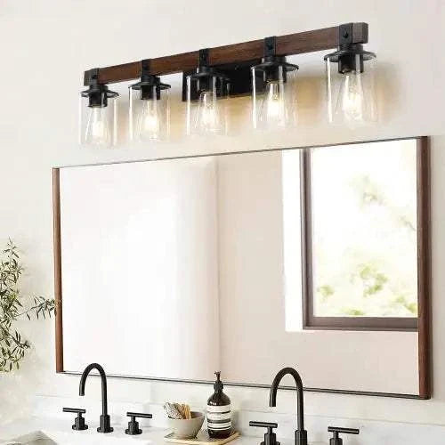 Farmhouse Dresser Lamps with rustic black iron frame and walnut-colored glass shades mounted above bathroom mirror