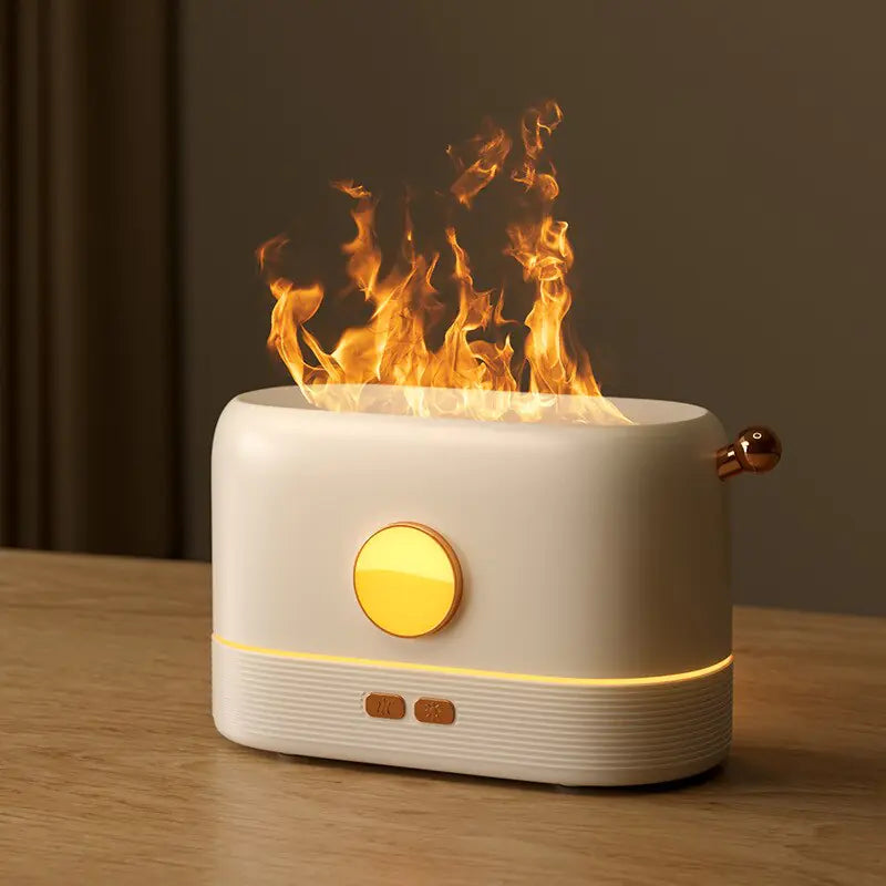 Flame Aroma Diffuser in white and gold tones with flickering flame effect and compact modern design on wooden surface