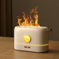 Flame Aroma Diffuser in white and gold tones with flickering flame effect and compact modern design on wooden surface
