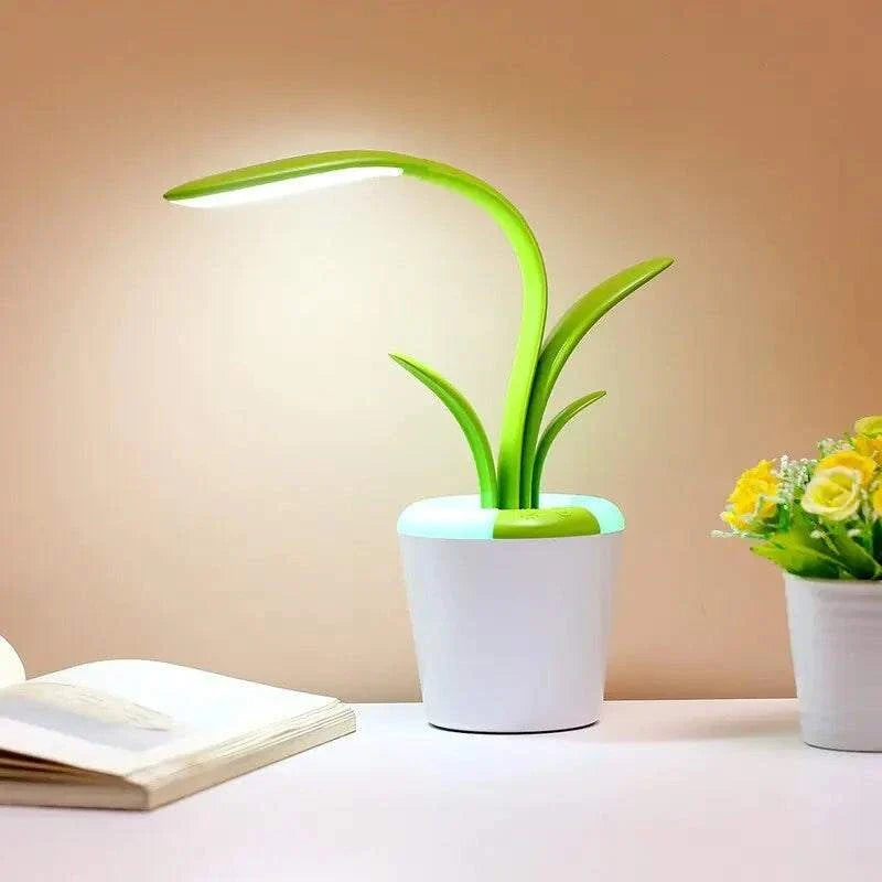 Flower Lamp with green flexible stem and leaves, soft white LED light, in a white flowerpot-style base with built-in USB port