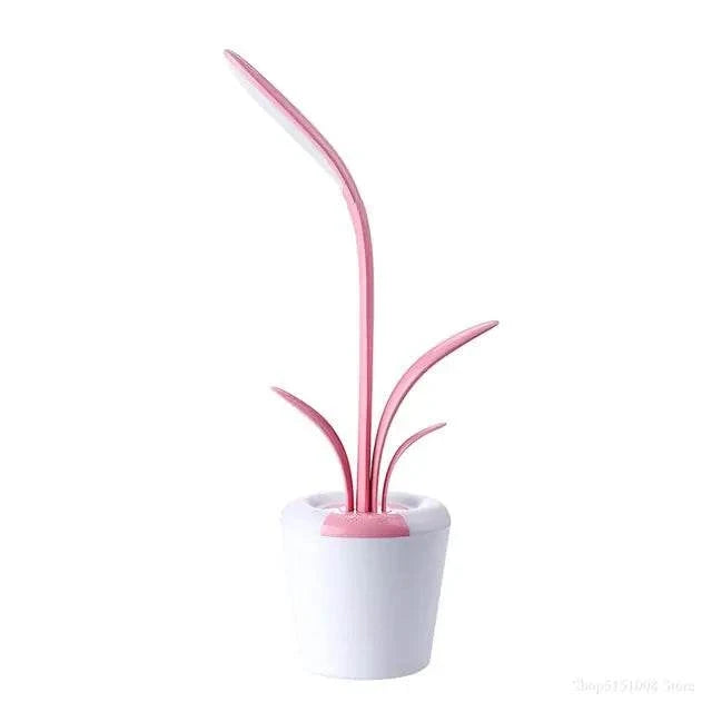 Flower Lamp in pink and white with a flowerpot base and adjustable LED light resembling a flower stem and leaves