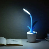 Flower Lamp with white flowerpot base and blue flexible neck featuring a leaf design, emitting soft white LED light