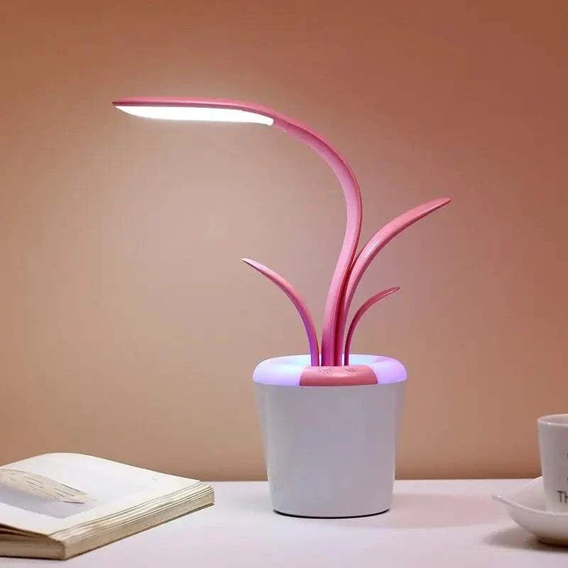 Flower Lamp in white flowerpot with pink curved succulent-like stems and integrated LED light providing soft illumination