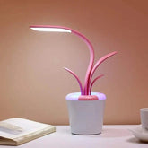 Flower Lamp in white flowerpot with pink curved succulent-like stems and integrated LED light providing soft illumination