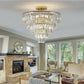 Golden crystal chandelier with five-layer round design in gold metal frame