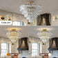 Golden Crystal Chandelier with a gold frame and layered clear crystal prisms in a round tiered design