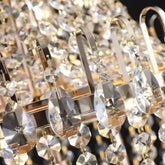 Golden Crystal Chandelier with polished gold metal loops and faceted clear crystal drops in a luxury design