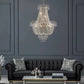 Golden Crystal Chandelier with a polished gold frame and cascading clear crystal beads in a tiered design