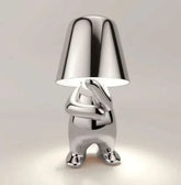 Impression LED Lamp with shiny metallic silver finish and figure-shaped base holding a smooth conical lampshade