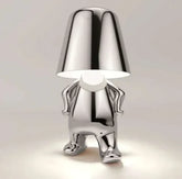 Impression LED Lamp in shiny metallic silver finish, designed as a small humanoid figure with a reflective lampshade head and glowing light beneath it