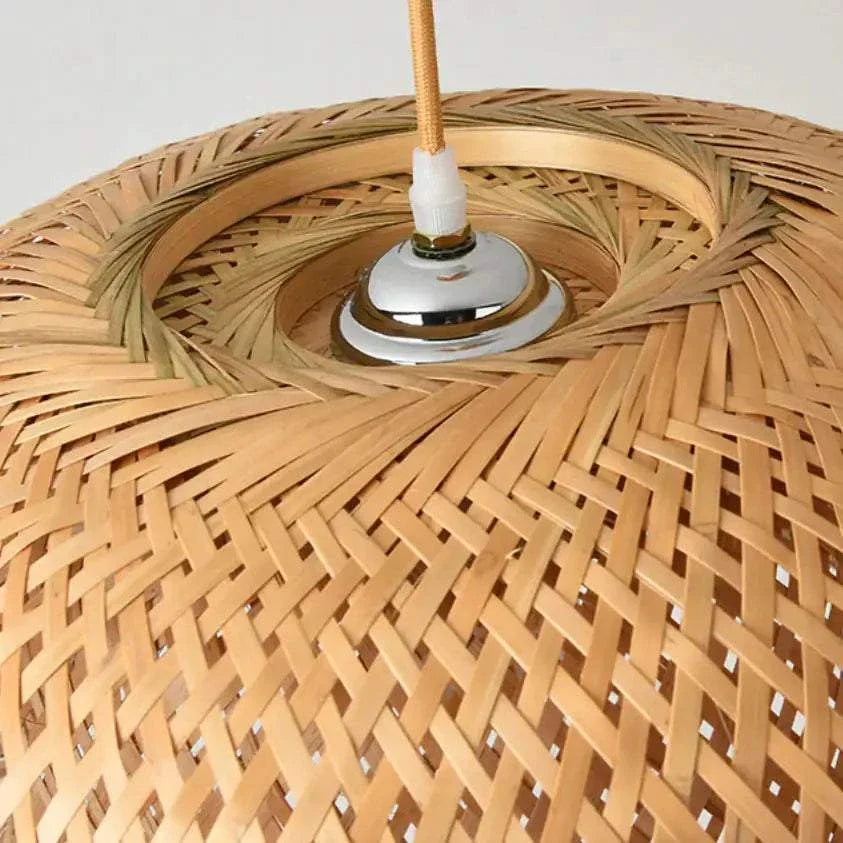 Kuma Bamboo Lamp with intricate woven natural bamboo pattern and metal socket detail at the top center